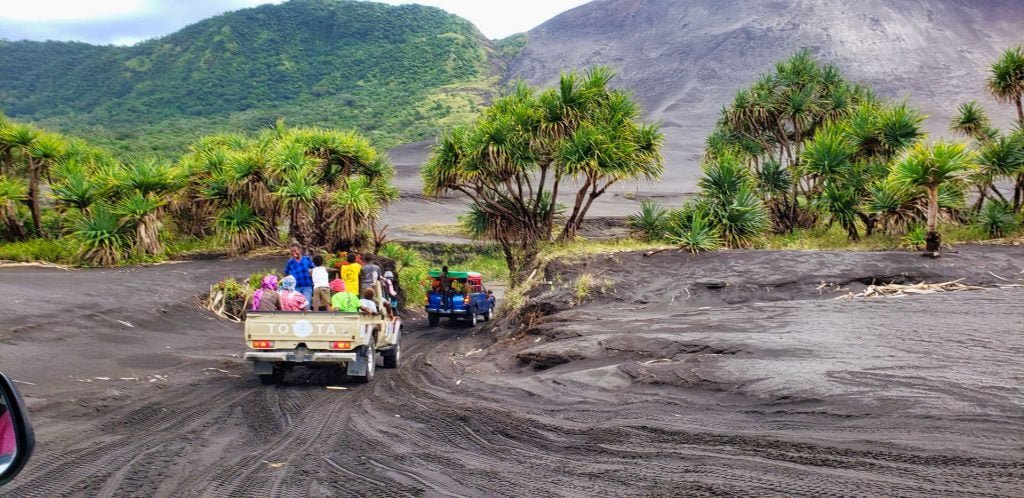 yasur volcano tanna vanuatu black volcanic ash pickup trucks locals trees